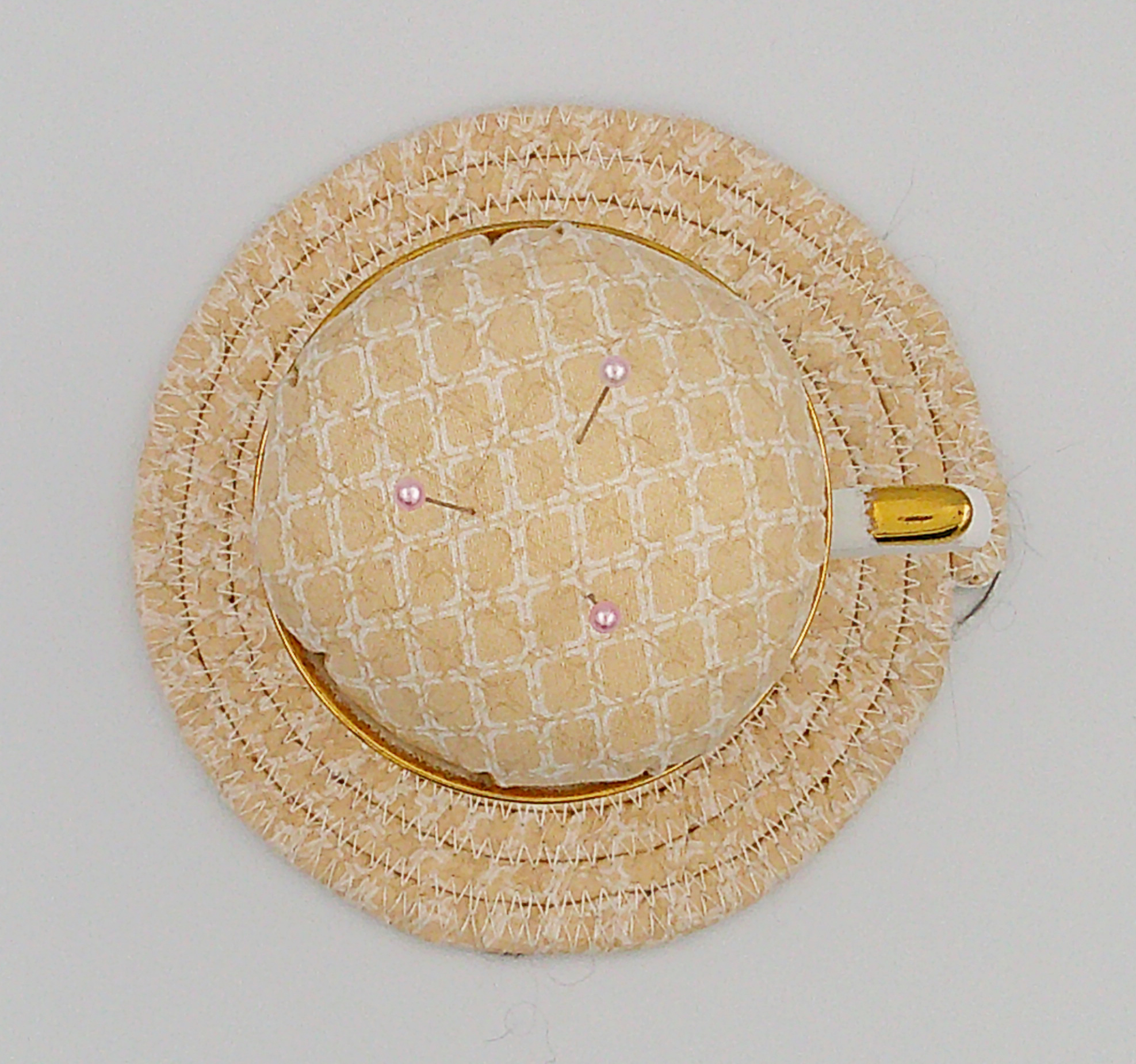 This is a view looking straight down from the top of the teacup pincushion sitting on the trivet. This is a view looking straight down from the top of the teacup pincushion sitting on the trivet.